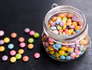 multicolored-glazed-candies-in-glass-jar.jpg